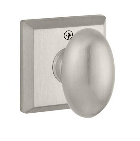 The Baldwin Reserve Ellipse Knob with Traditional Square Rosette in Satin Nickel finish.