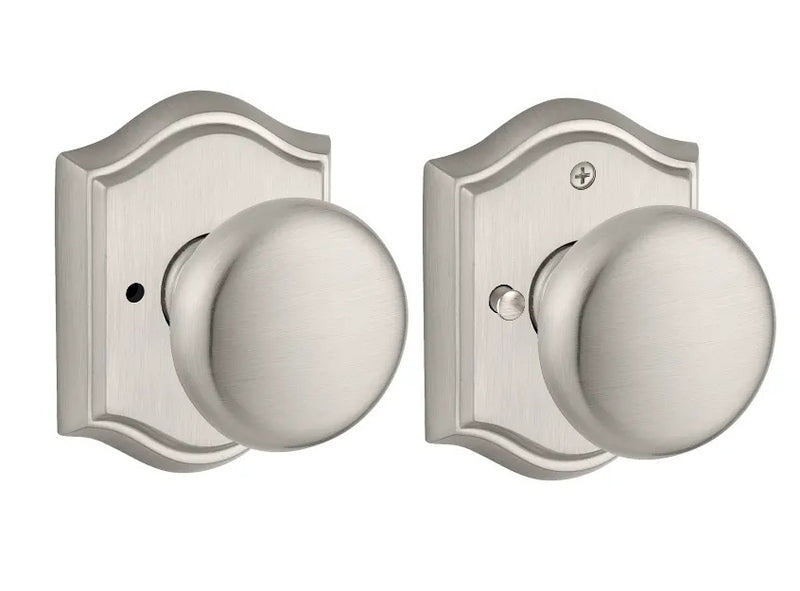The Baldwin Reserve Round Knob with Traditional Arch Rosette in Satin Nickel finish.