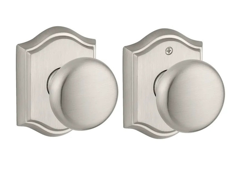 The Baldwin Reserve Round Knob with Traditional Arch Rosette in Satin Nickel finish.