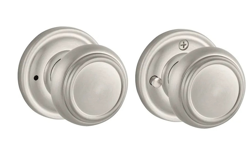The Baldwin Reserve Traditional Knob with Traditional Round Rosette in Satin Nickel finish.