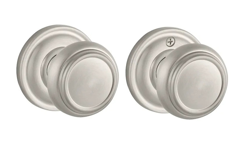 The Baldwin Reserve Traditional Knob with Traditional Round Rosette in Satin Nickel finish.