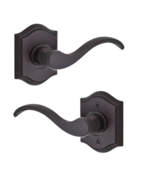 The Baldwin Reserve Curve Lever with Traditional Arch Rosette in Venetian Bronze finish.