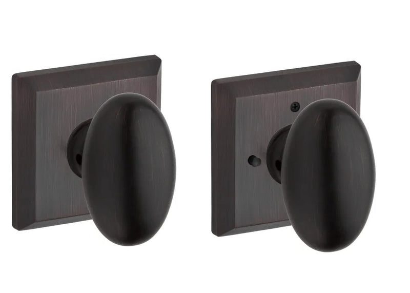 The Baldwin Reserve Ellipse Knob with Traditional Square Rosette in Venetian Bronze finish.