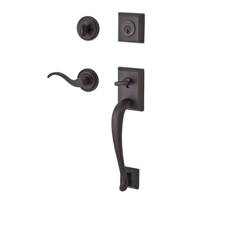 The Baldwin Reserve Napa Handleset with Interior Curve Lever with Traditional Round Rosette in Venetian Bronze finish.