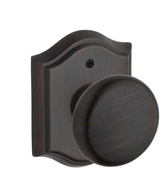The Baldwin Reserve Round Knob with Traditional Arch Rosette in Venetian Bronze finish.
