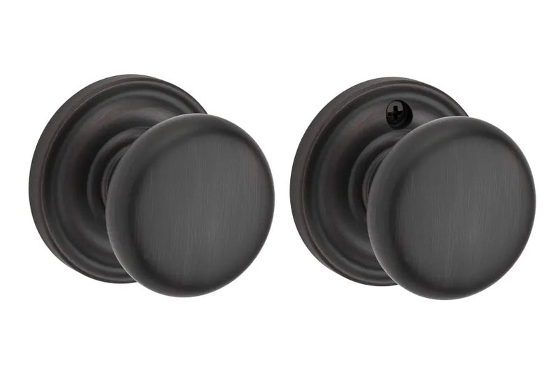 The Baldwin Reserve Round Knob with Traditional Round Rosette in Venetian Bronze finish.
