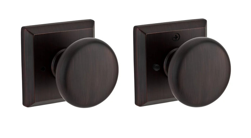 The Baldwin Reserve Round Knob with Traditional Square Rosette in Venetian Bronze finish.