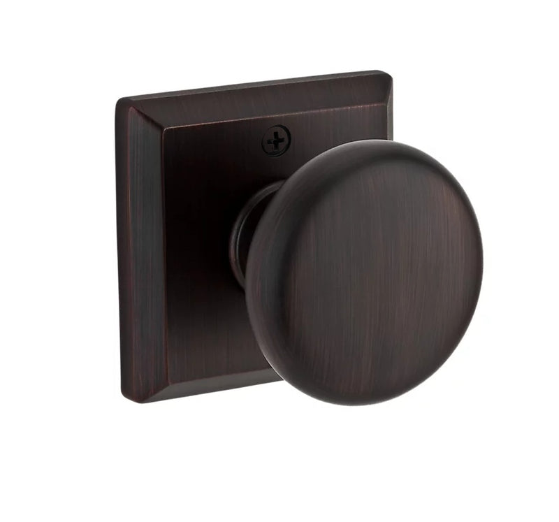The Baldwin Reserve Round Knob with Traditional Square Rosette in Venetian Bronze finish.