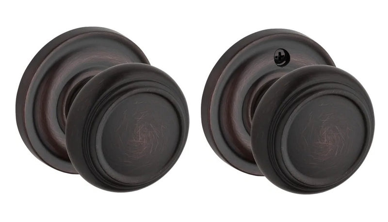 The Baldwin Reserve Traditional Knob with Traditional Round Rosette in Venetian Bronze finish.