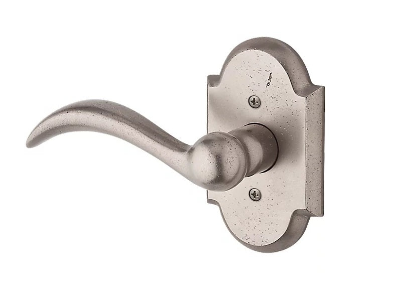 The Baldwin Reserve Arch Lever with Rustic Arch Rosette in White Bronze finish.