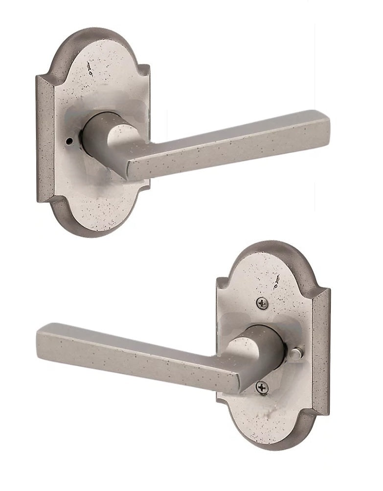 The Baldwin Reserve Taper Lever with Rustic Arch Rosette in White Bronze finish.