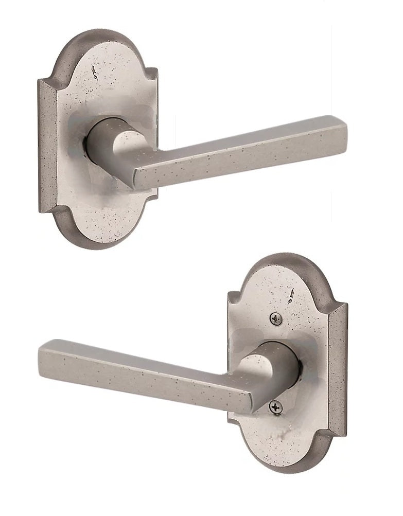The Baldwin Reserve Taper Lever with Rustic Arch Rosette in White Bronze finish.