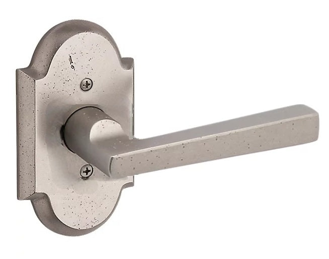 The Baldwin Reserve Taper Lever with Rustic Arch Rosette in White Bronze finish.