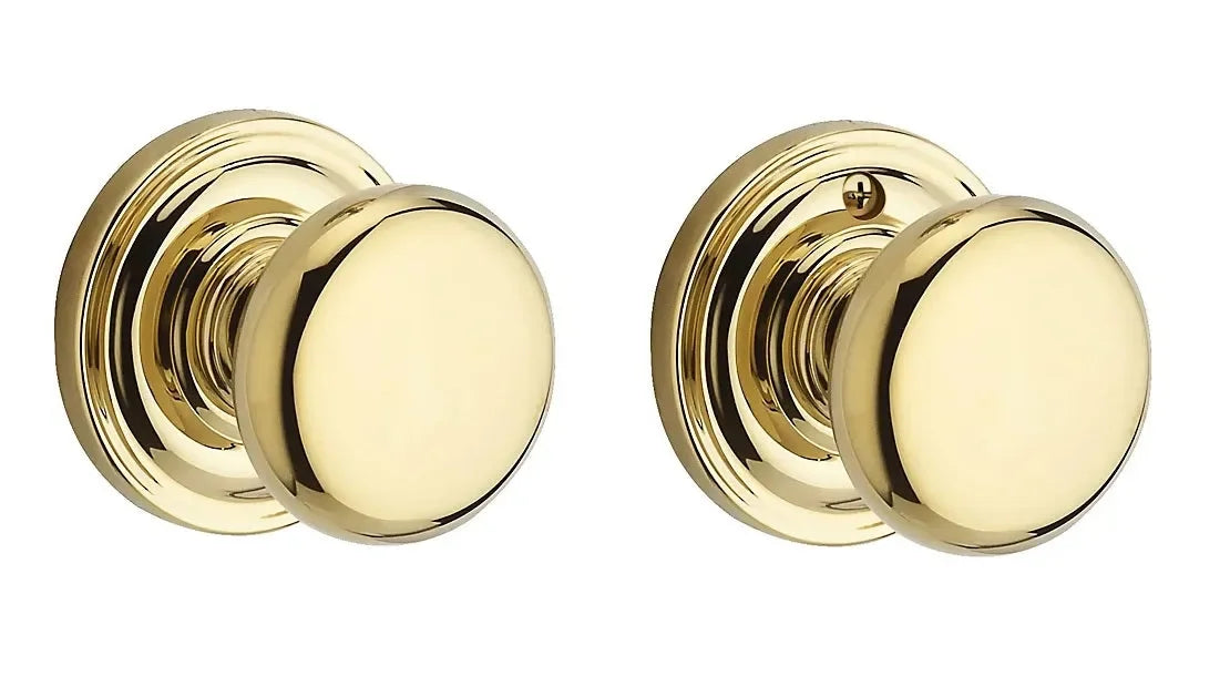 The Baldwin Reserve Round Knob with Traditional Round Rosette in Lifetime Polished Brass finish.