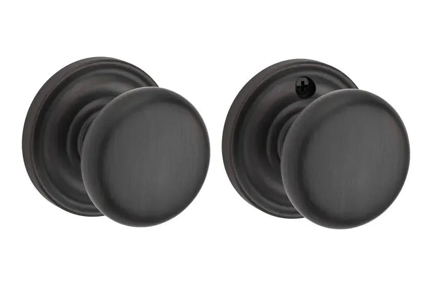 The Baldwin Reserve Round Knob with Traditional Round Rosette in Venetian Bronze finish.