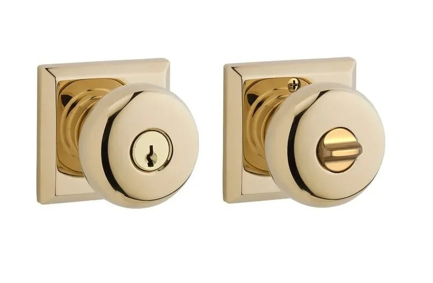 The Baldwin Reserve Round Knob with Traditional Square Rosette in Lifetime Polished Brass finish.