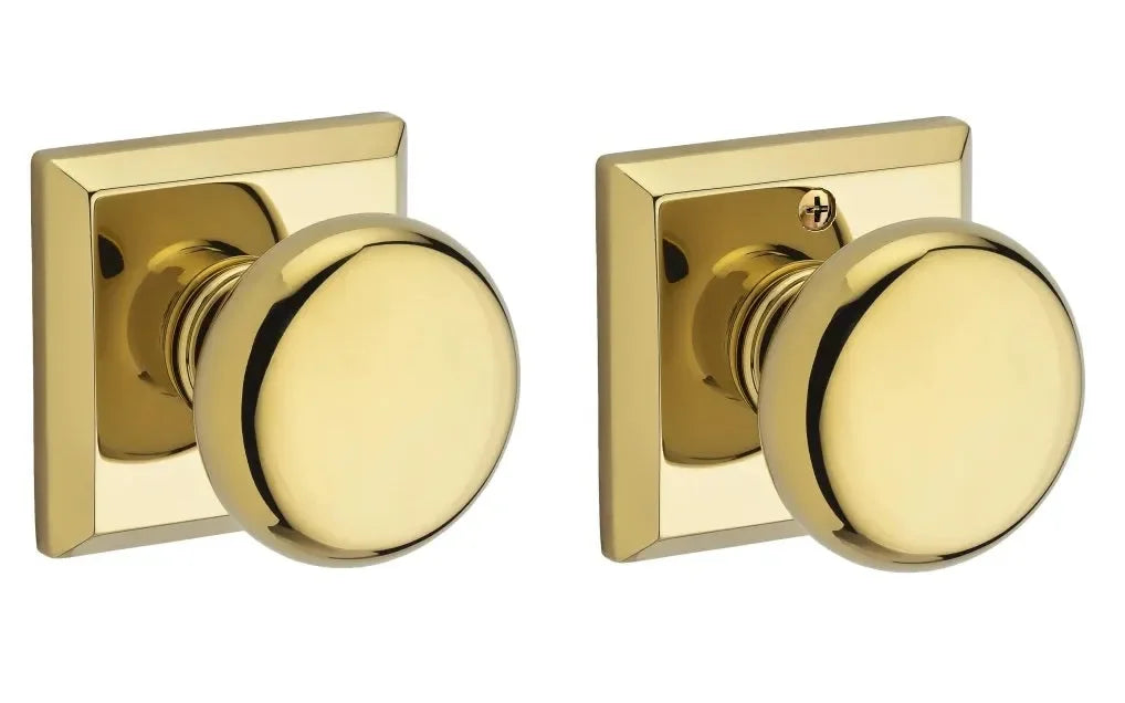 The Baldwin Reserve Round Knob with Traditional Square Rosette in Lifetime Polished Brass finish.