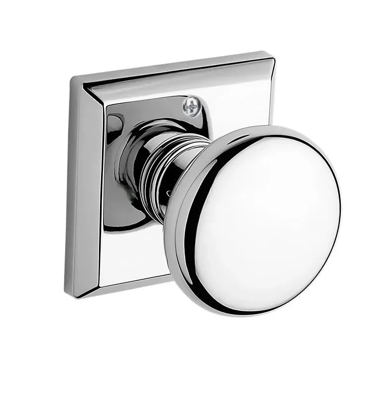 The Baldwin Reserve Round Knob with Traditional Square Rosette in Polished Chrome finish.