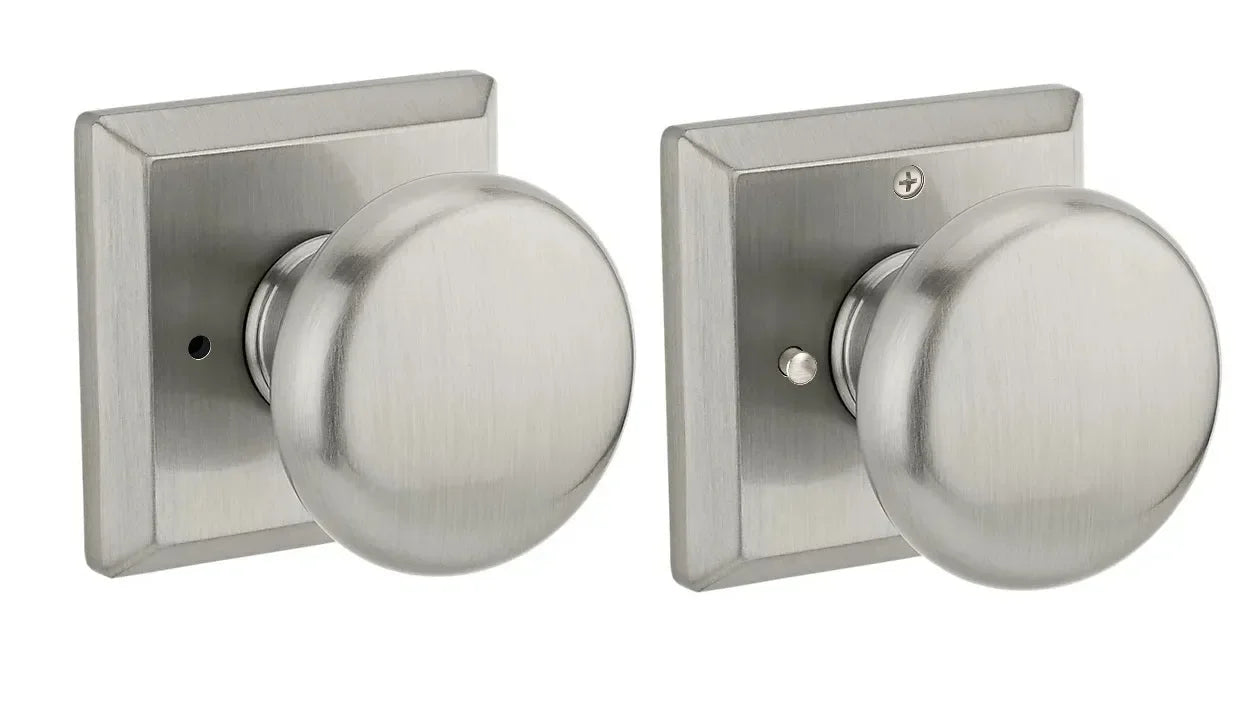 The Baldwin Reserve Round Knob with Traditional Square Rosette in Satin Nickel finish.