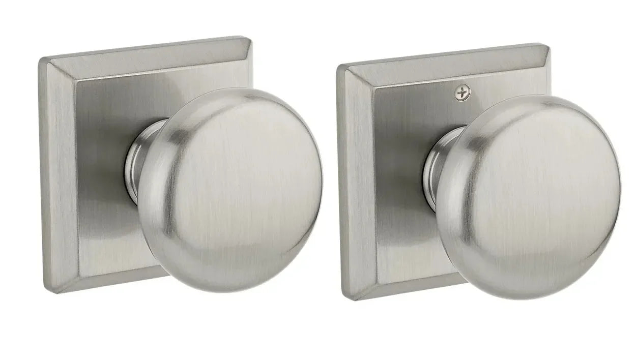 The Baldwin Reserve Round Knob with Traditional Square Rosette in Satin Nickel finish.