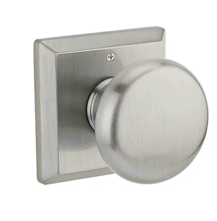 The Baldwin Reserve Round Knob with Traditional Square Rosette in Satin Nickel finish.