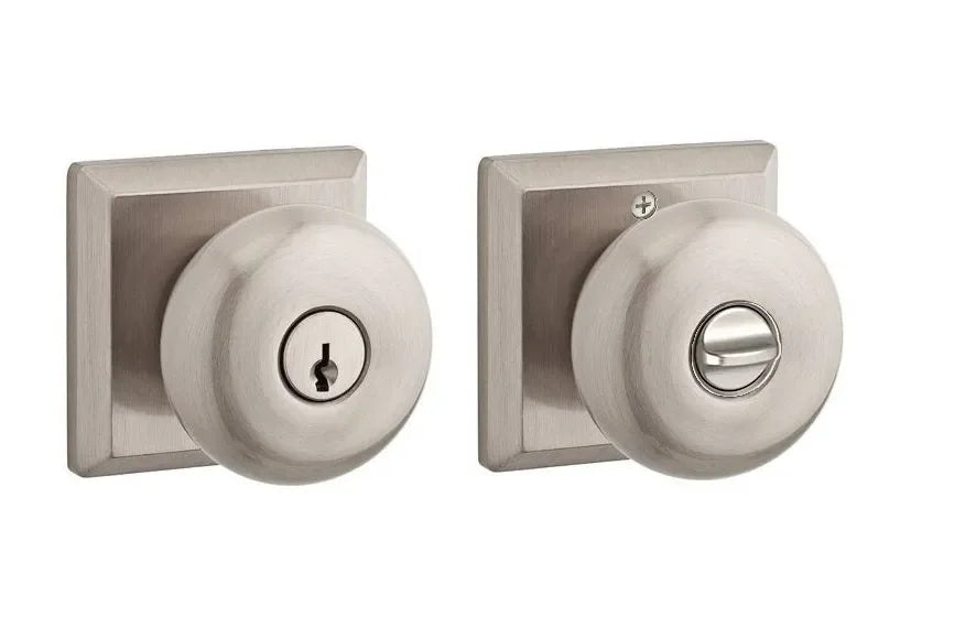 The Baldwin Reserve Round Knob with Traditional Square Rosette in Satin Nickel finish.