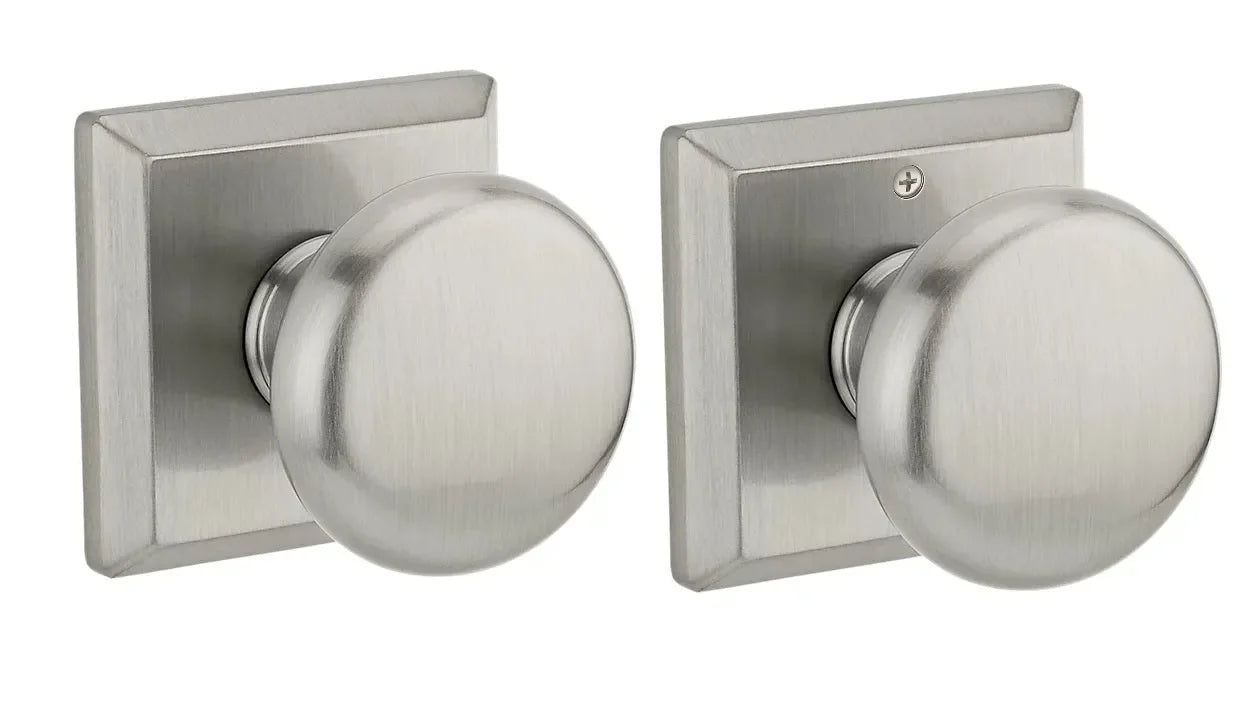 The Baldwin Reserve Round Knob with Traditional Square Rosette in Satin Nickel finish.