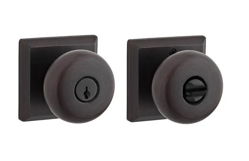 The Baldwin Reserve Round Knob with Traditional Square Rosette in Venetian Bronze finish.