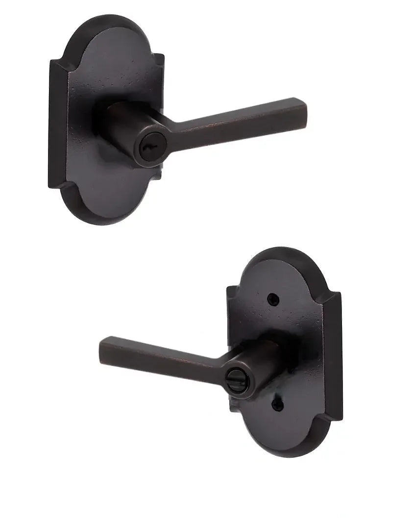 The Baldwin Reserve Taper Lever with Rustic Arch Rosette in finish.