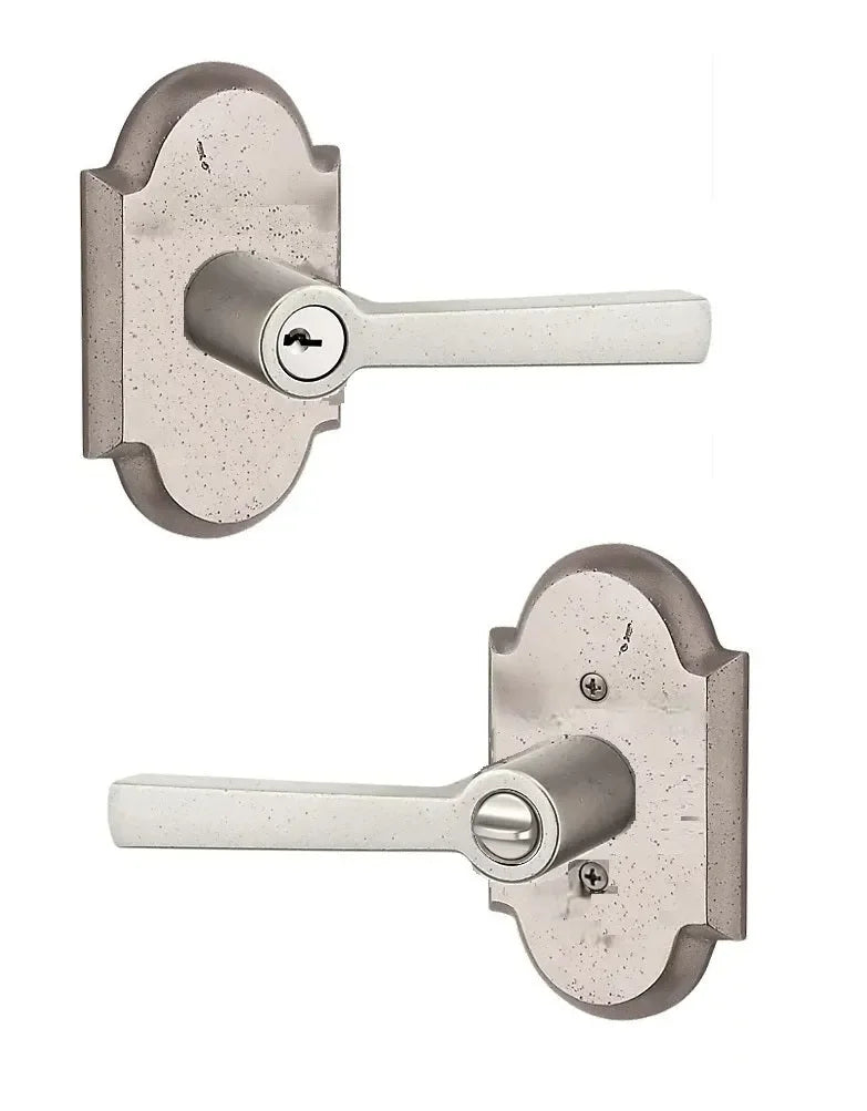 The Baldwin Reserve Taper Lever with Rustic Arch Rosette in White Bronze finish.