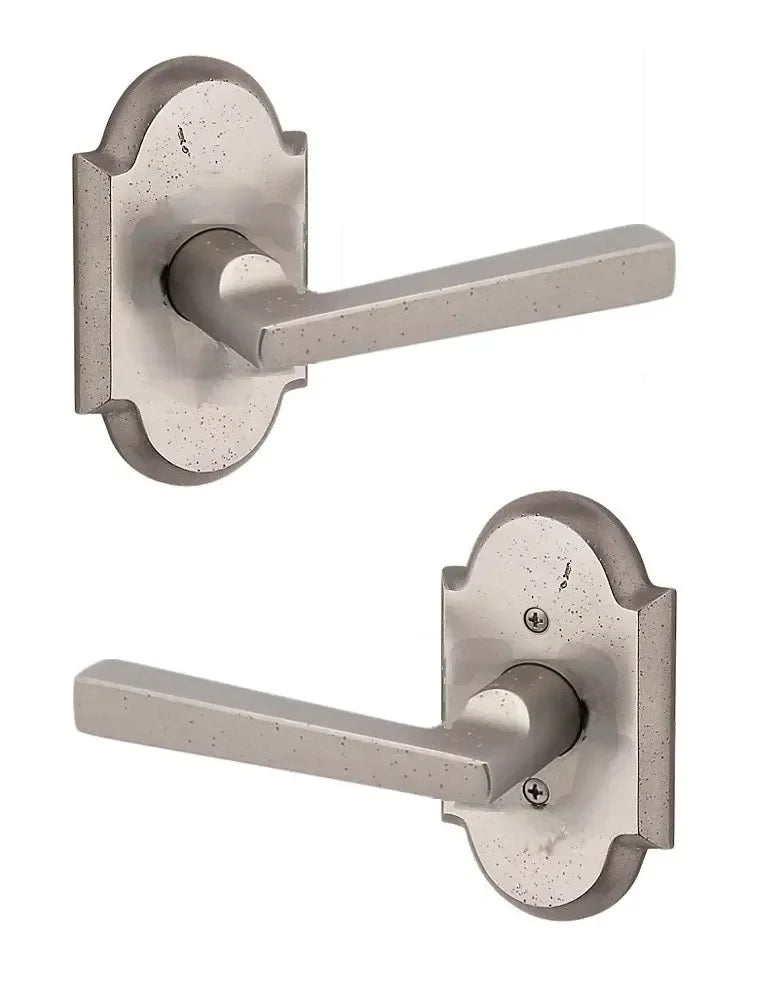 The Baldwin Reserve Taper Lever with Rustic Arch Rosette in White Bronze finish.