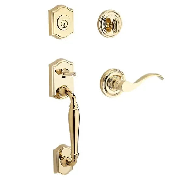 The Baldwin Reserve Westcliff Handleset with Interior Curve Lever with Traditional Round Rosette in Lifetime Polished Brass finish.
