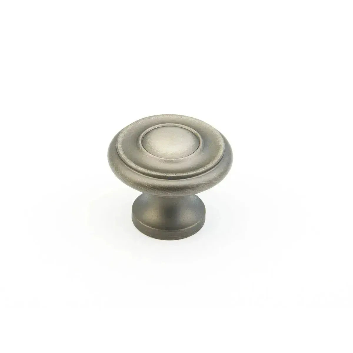 The Schaub Traditional Stepped Round Cabinet Knob in Antique Nickel finish.