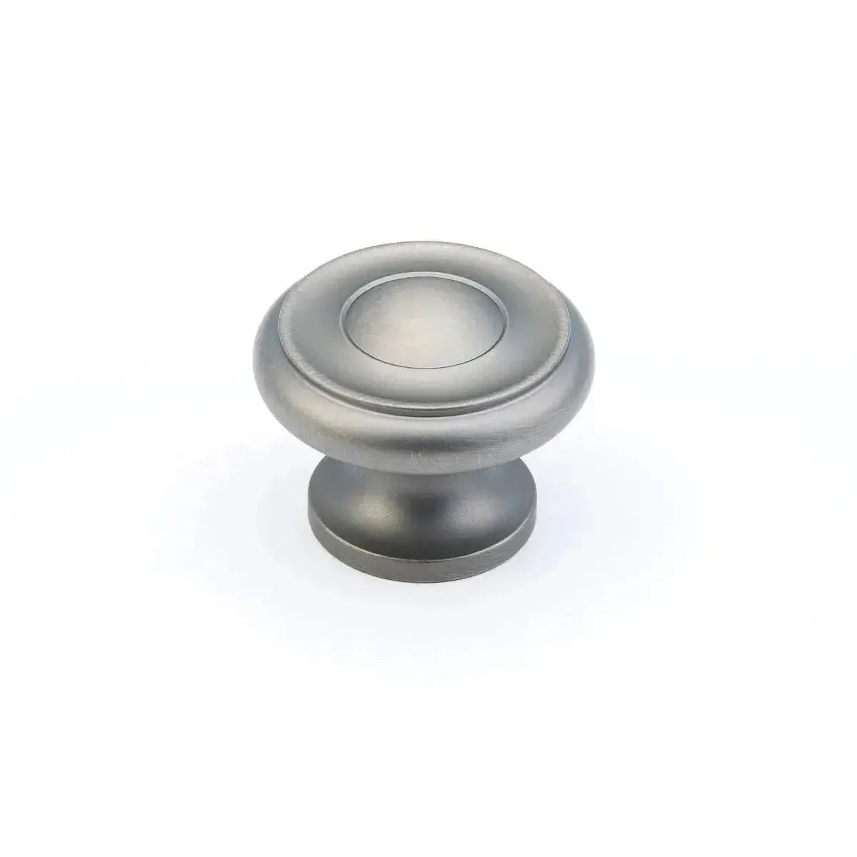 The Schaub Traditional Stepped Round Cabinet Knob in Antique Nickel finish.