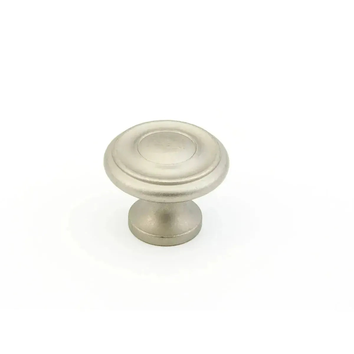 The Schaub Traditional Stepped Round Cabinet Knob in Distressed Nickel finish.