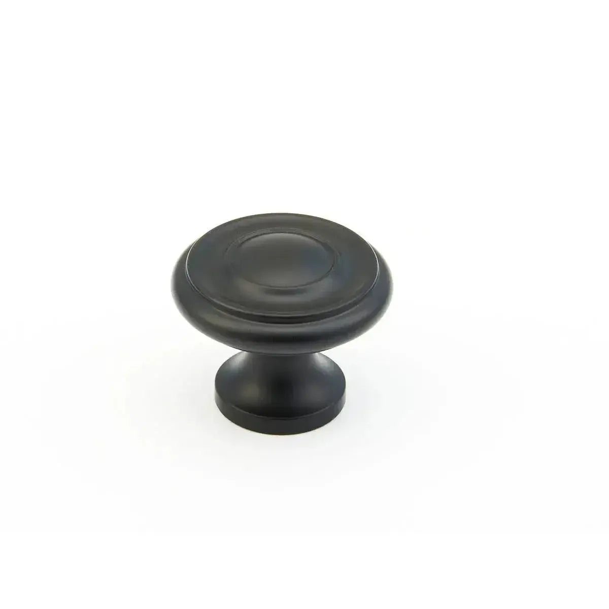 The Schaub Traditional Stepped Round Cabinet Knob in Flat Black finish.