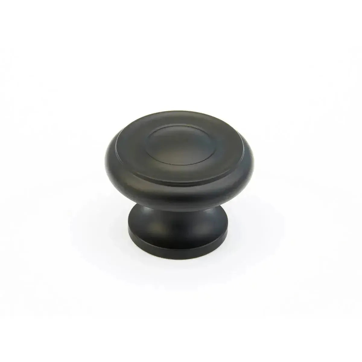 The Schaub Traditional Stepped Round Cabinet Knob in Flat Black finish.