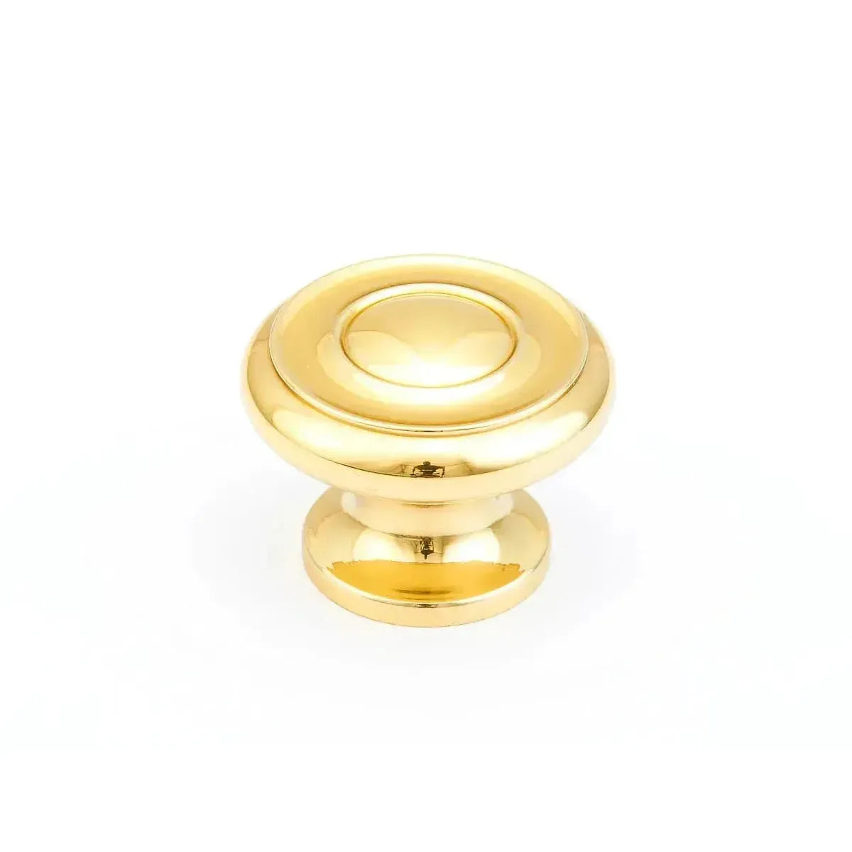 The Schaub Traditional Stepped Round Cabinet Knob in Polished Brass finish.