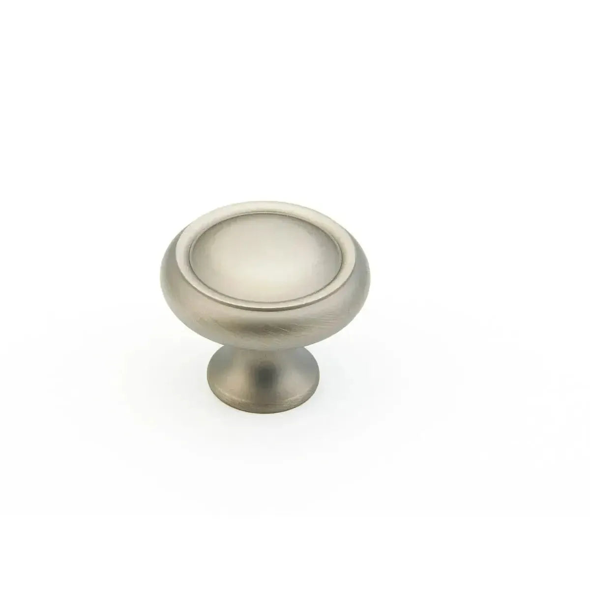 The Schaub Country Rimmed Round Cabinet Knob in Antique Nickel finish.