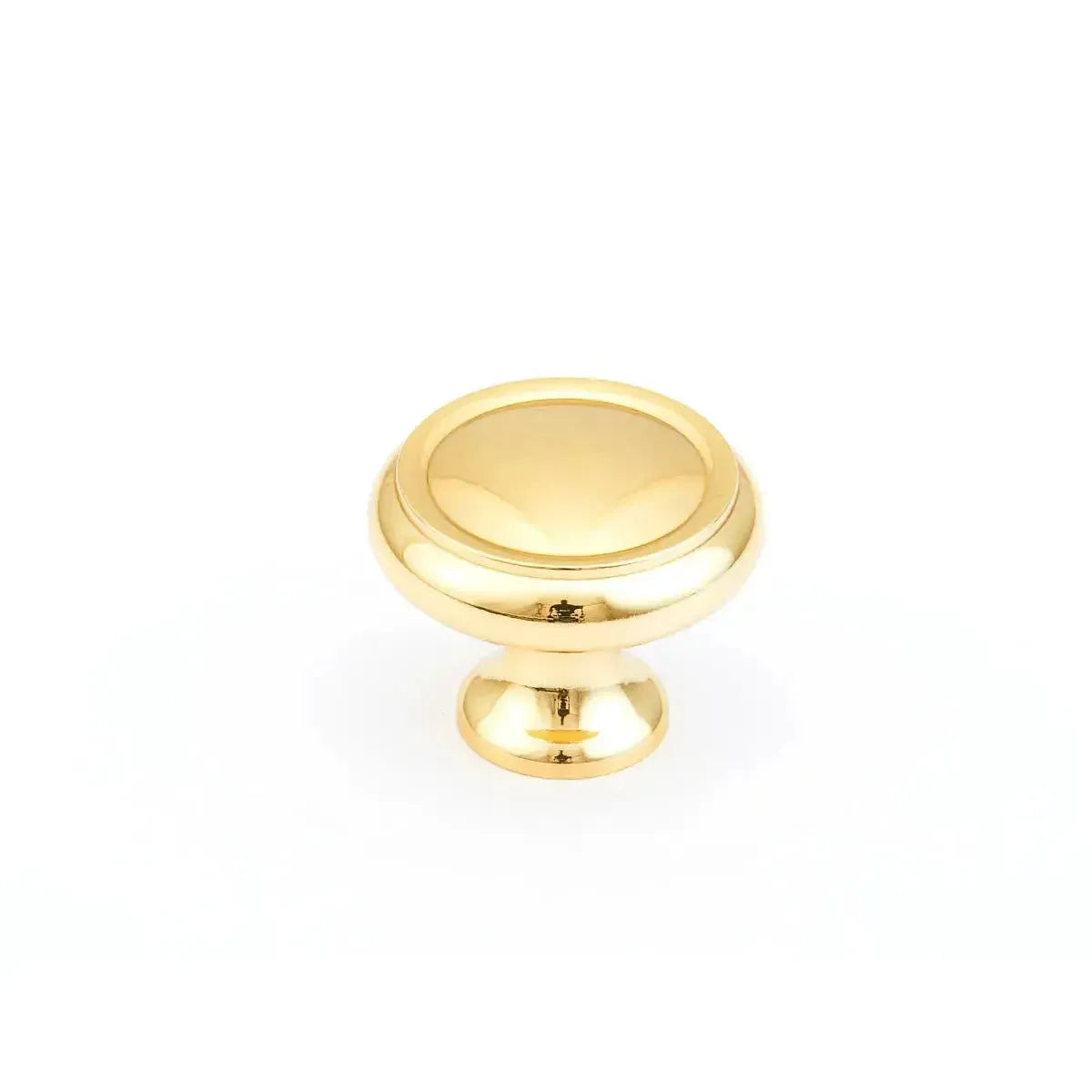 The Schaub Country Rimmed Round Cabinet Knob in Polished Brass finish.