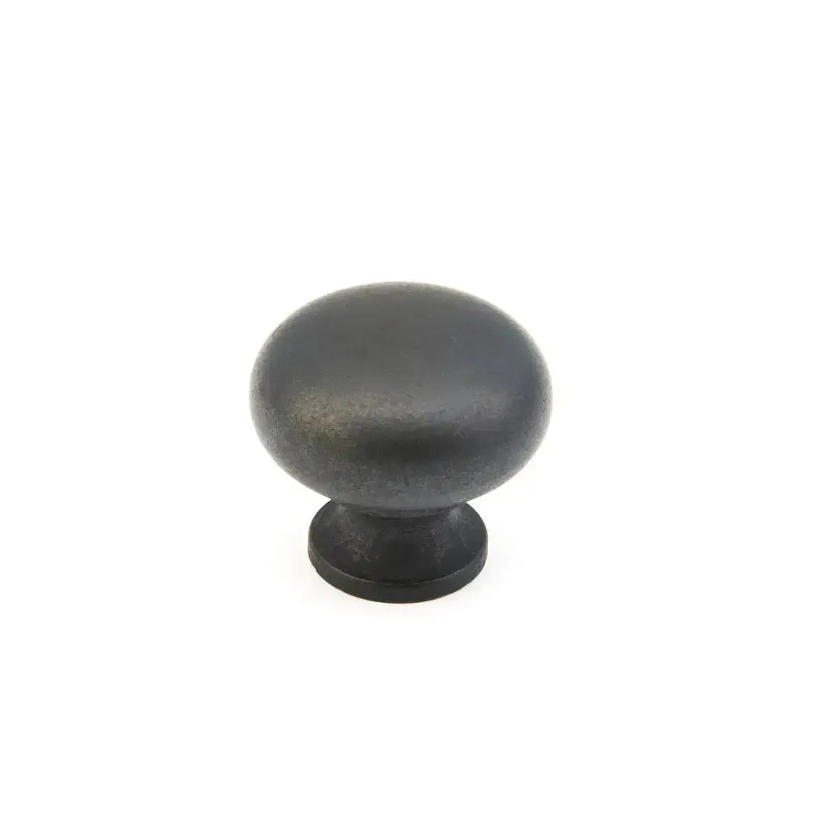 The Schaub Traditional Round Cabinet Knob in Distressed Bronze finish.