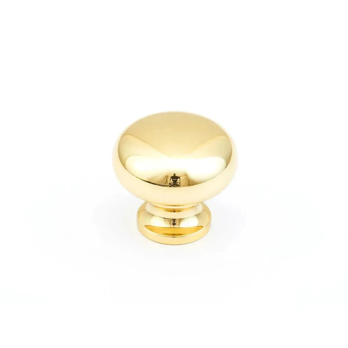 The Schaub Traditional Round Cabinet Knob in Polished Brass finish.