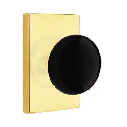 Emtek Ebony Porcelain Knob with Modern Rectangular Rosette in Unlacquered Brass finish
