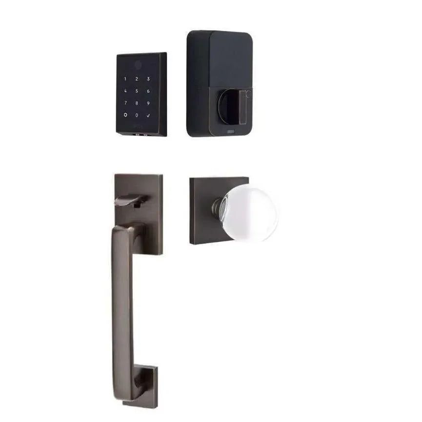 The Emtek EMPowered 2 Touch Entry Set with Baden Grip and Interior Bristol Glass Knob in Oil Rubbed Bronze finish.