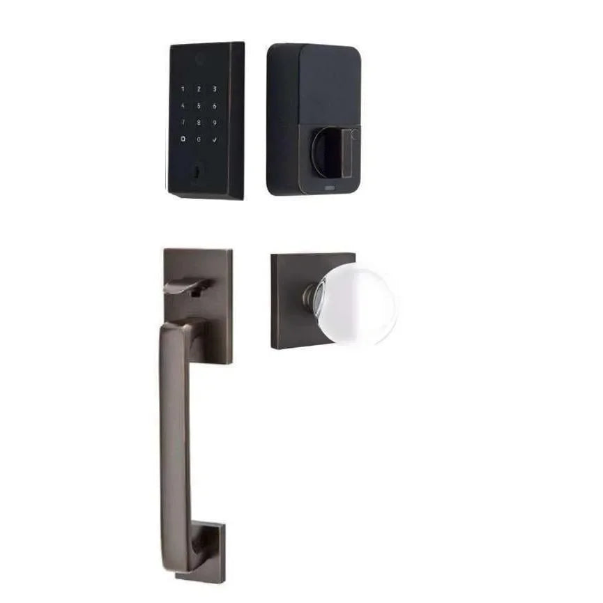 The Emtek EMPowered 2 Touch Entry Set with Baden Grip and Interior Bristol Glass Knob in Oil Rubbed Bronze finish.
