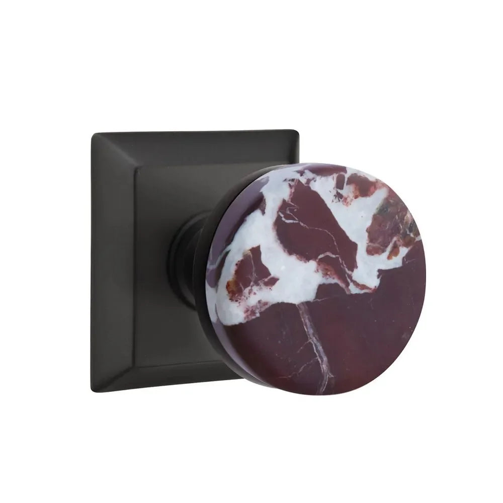 The Emtek Select Conical Rosso Levanto Marble Knobset with Quincy Rosette in Flat Black finish.