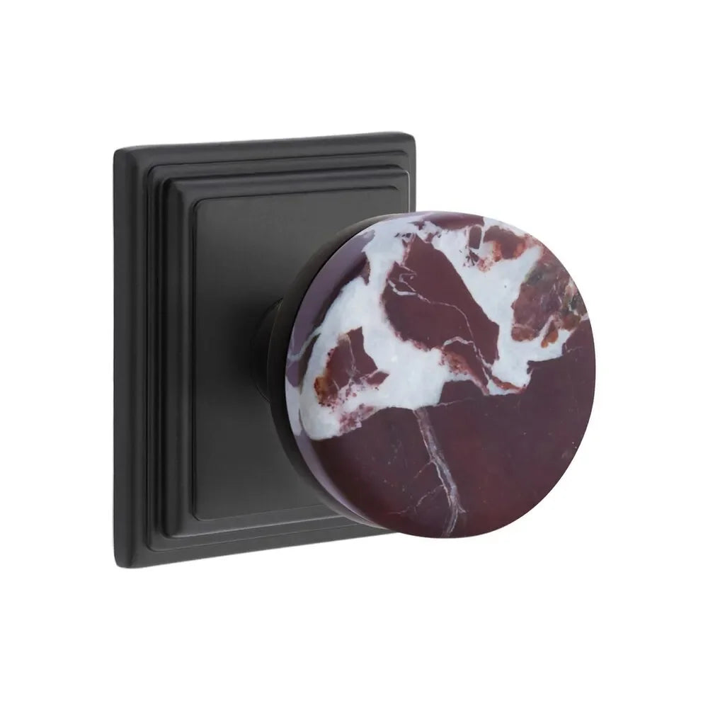 The Emtek Select Conical Rosso Levanto Marble Knobset with Wilshire Rosette in Flat Black finish.