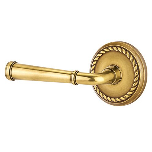 The Emtek Merrimack Lever With Rope Rosette in French Antique finish