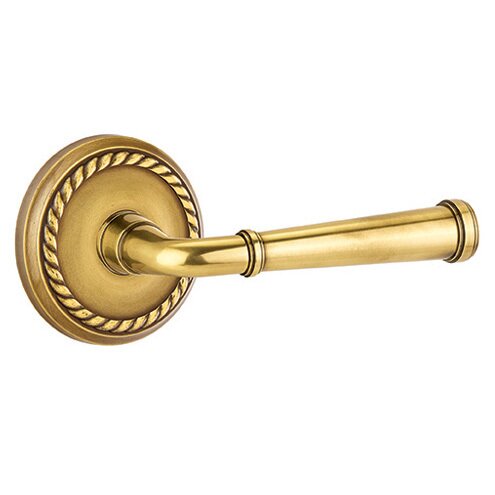 The Emtek Merrimack Lever With Rope Rosette in French Antique finish