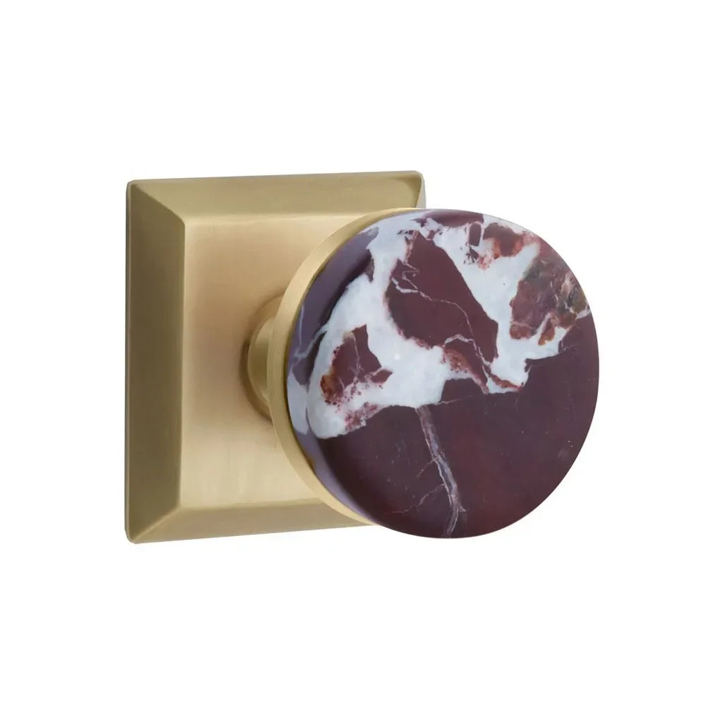 The Emtek Select Conical Rosso Levanto Marble Knobset with Quincy Rosette in French Antique finish.